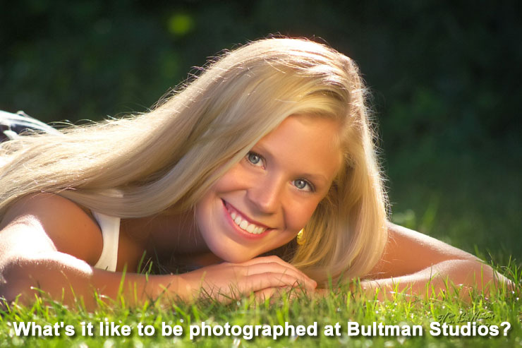 What's it like to be photographed at Bultman Studios? Picture of a young lady posing outside in a grassy field. Copyrighted by Bultman Studios.